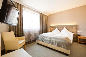 Postelja oz. postelje v sobi nastanitve Stadthotel Goldenes Schiff