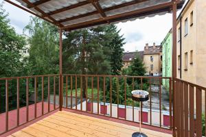 a balcony with a view of a yard at Penzion Hotel Morrison in Pilsen