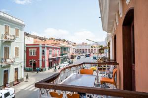 a balcony with a view of a city street at Royal Mindelo Suite in Mindelo