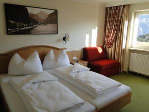 Łóżko lub łóżka w pokoju w obiekcie Gasthof und Hotel Rieder GmbH