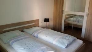 A bed or beds in a room at Apartment Bruneck Central