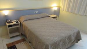 Katil atau katil-katil dalam bilik di Asppen Hotel