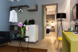 TV a/nebo společenská místnost v ubytování CinqueSuites Ortigia