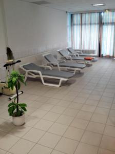 a row of empty chairs in a waiting room at Apartment Regina in Möhnesee