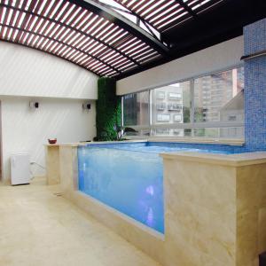 Bazén v ubytování Hotel Madeiro nebo v jeho okolí