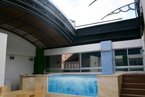 Bazén v ubytování Hotel Madeiro nebo v jeho okolí