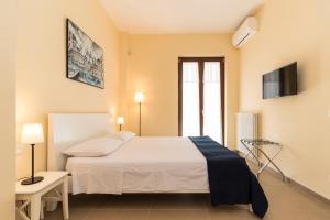 Ένα ή περισσότερα κρεβάτια σε δωμάτιο στο Corte dei Nobili