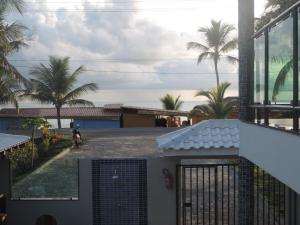 a view of the ocean from the balcony of a house at Areia do Atlantico Hotel in Porto Seguro