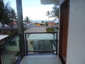 a balcony with a view of the ocean at Areia do Atlantico Hotel in Porto Seguro