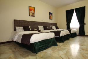 Postel nebo postele na pokoji v ubytování Hotel San Fernando Real