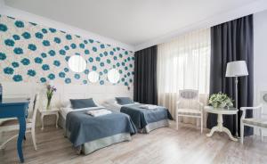 Łóżko lub łóżka w pokoju w obiekcie Hotel Afrodyta Business & Spa
