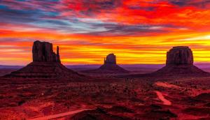 a view of the desert at sunset with rocks at Goulding's Lodge in Monument Valley