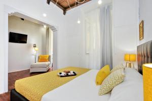 A bed or beds in a room at Laterano 238 Apartment