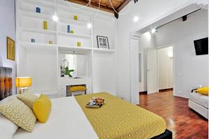 A bed or beds in a room at Laterano 238 Apartment