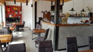 a bar with chairs and a counter in a restaurant at Ydykseb in Frýdlant nad Ostravicí