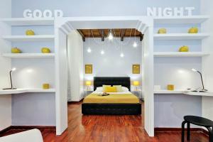 A bed or beds in a room at Laterano 238 Apartment