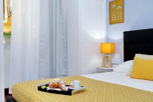 A bed or beds in a room at Laterano 238 Apartment