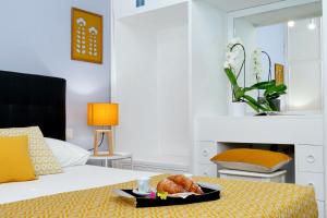 A bed or beds in a room at Laterano 238 Apartment