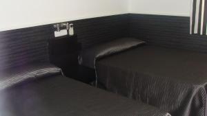 A bed or beds in a room at Hostal JQ Madrid 1