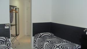 A bed or beds in a room at Hostal JQ Madrid 1