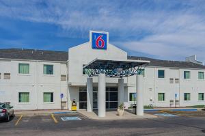 a building with a sign on the front of it at Motel 6-Wheatland, WY in Wheatland