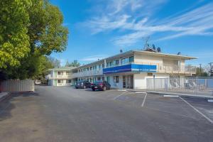 a parking lot in front of a building at Motel 6-Red Bluff, CA in Red Bluff