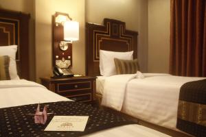 Voodi või voodid majutusasutuse Herald Suites Polaris toas
