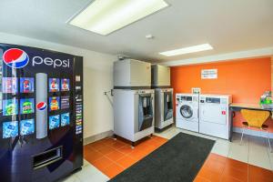 a laundry room with a washer and dryer at Ocean Inn South Padre Island in South Padre Island