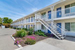 a building with a staircase in a parking lot at Motel 6-Santa Maria, CA - South in Santa Maria