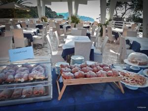 a display of food on a table in a restaurant at Hotel Eden in San Domino