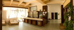 a hospital lobby with a waiting room with a large window at Hotel Eden in San Domino