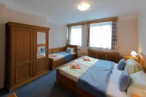 Posteľ alebo postele v izbe v ubytovaní Hotel Soudek