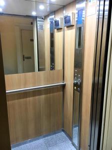 a row of wooden elevators in a building at Beachfront apartment Promenade Des Anglais in Nice