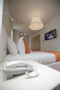 Postel nebo postele na pokoji v ubytování Hotel Bulqiza