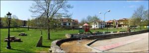 a park with a playground with a fountain and a fire hydrant at Hotel Los Hidalgos in Santillana del Mar