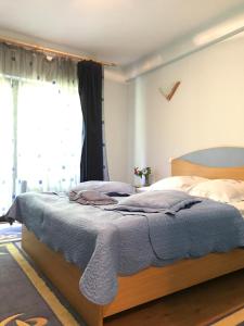 Ein Bett oder Betten in einem Zimmer der Unterkunft Pensiunea Mario