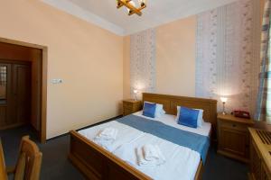 Posteľ alebo postele v izbe v ubytovaní Hotel Soudek