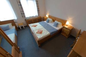 Posteľ alebo postele v izbe v ubytovaní Hotel Soudek