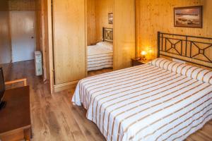 Postel nebo postele na pokoji v ubytování Pension Restaurante Cantábrico