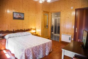 Postel nebo postele na pokoji v ubytování Pension Restaurante Cantábrico