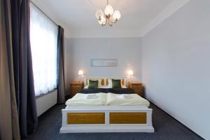 Posteľ alebo postele v izbe v ubytovaní Hotel Soudek