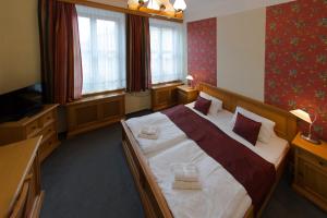 Posteľ alebo postele v izbe v ubytovaní Hotel Soudek