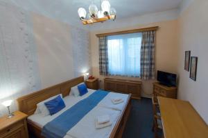 Posteľ alebo postele v izbe v ubytovaní Hotel Soudek