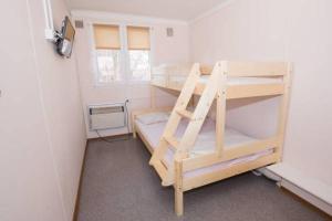 a room with two bunk beds and a window at Hostel Metro in Warsaw