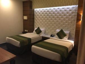 Postel nebo postele na pokoji v ubytování Hotel Ivory 32