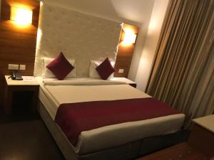 Postel nebo postele na pokoji v ubytování Hotel Ivory 32