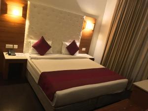 Postel nebo postele na pokoji v ubytování Hotel Ivory 32