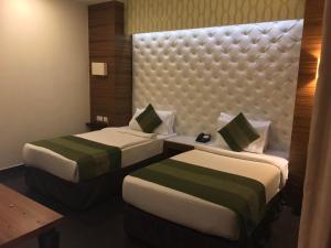 Postel nebo postele na pokoji v ubytování Hotel Ivory 32