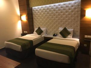 Postel nebo postele na pokoji v ubytování Hotel Ivory 32