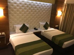 Postel nebo postele na pokoji v ubytování Hotel Ivory 32